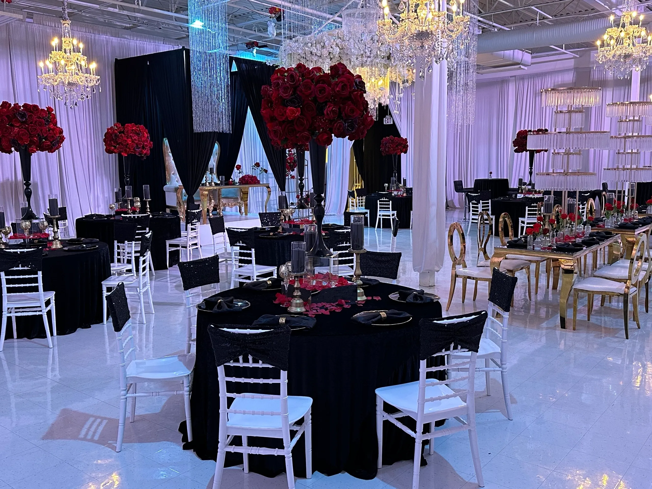 Formal dining area with black table settings.